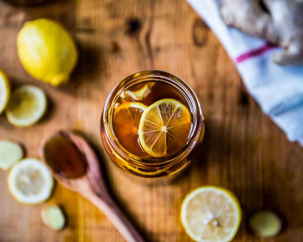 lemon honey ginger tea concentrate in a glass jar.