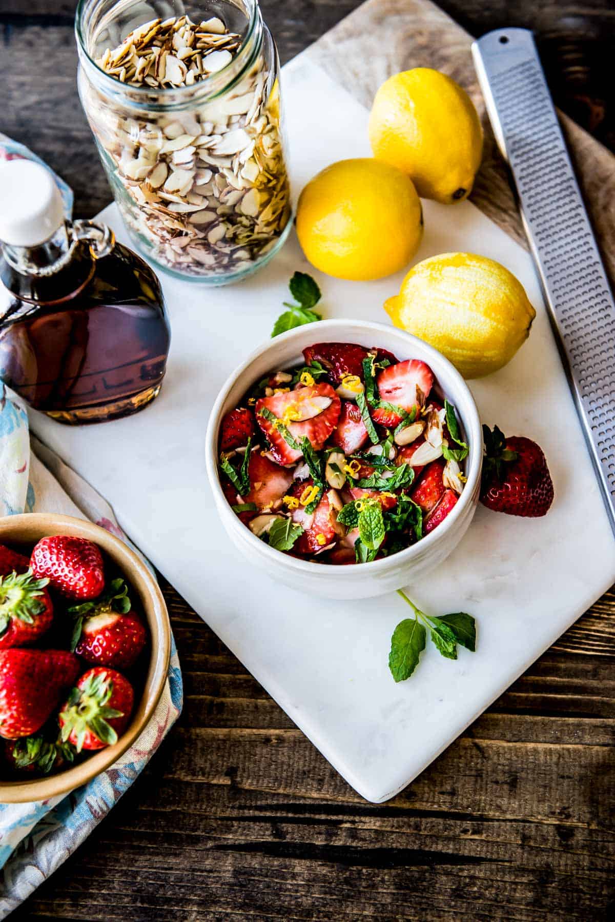 beautiful strawberries, lemon, maple syrup and mint form a delicious snack