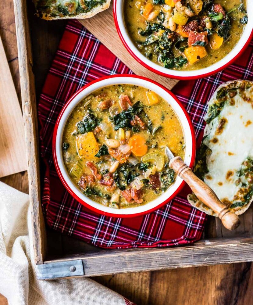 an overhead shot of vegan minestrone soup that displays many of the veggies cooked to make this delicious soup.