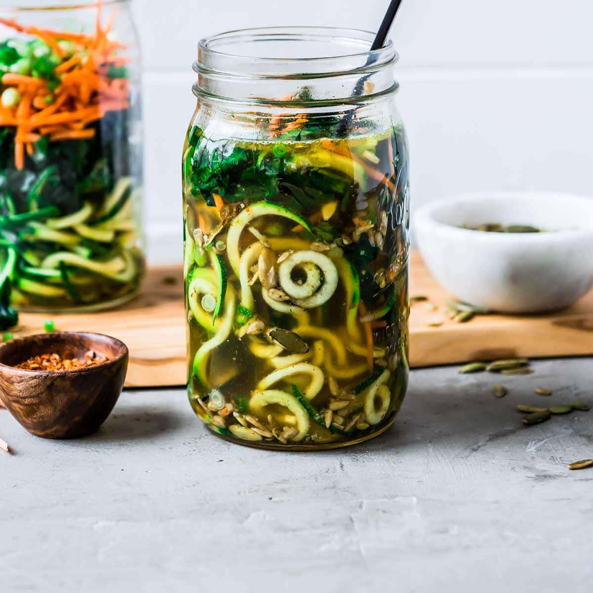 Zoodles in a glass jar that are spiralized.