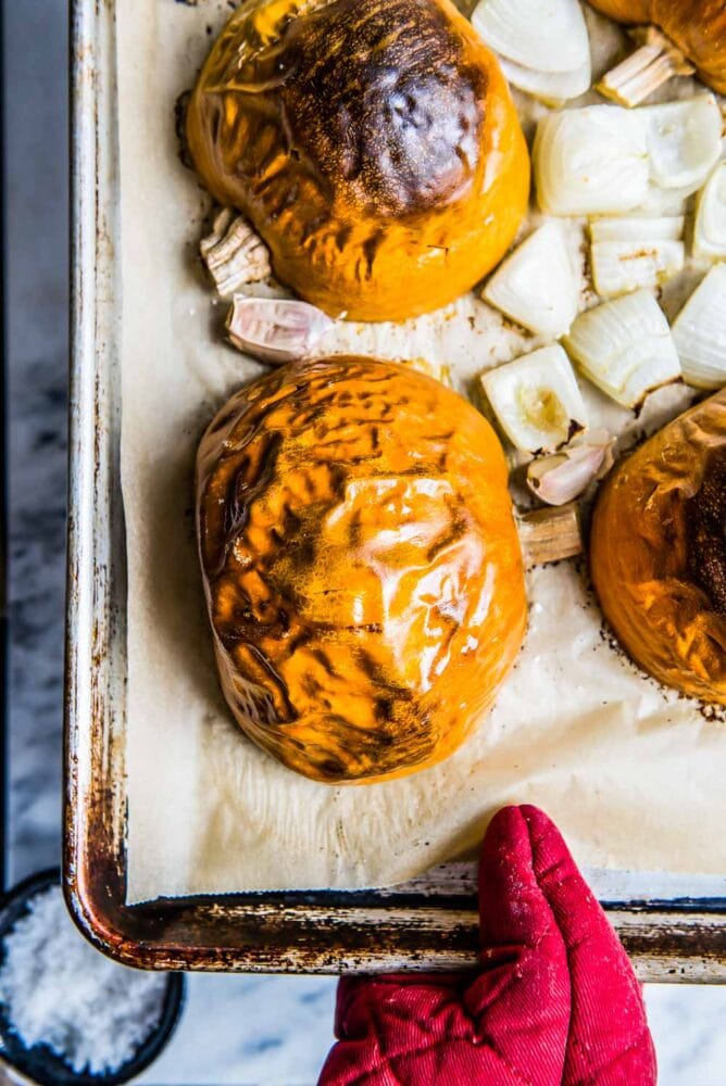 roasted pumpkin halves with roasted garlic and onions for a vegan pumpkin soup recipe