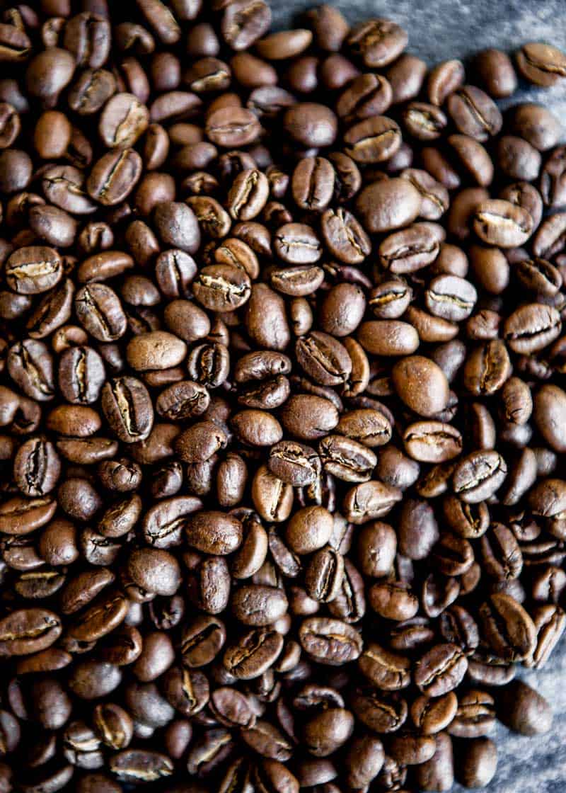 photo of whole, roasted coffee beans ready for a healthy coffee recipe