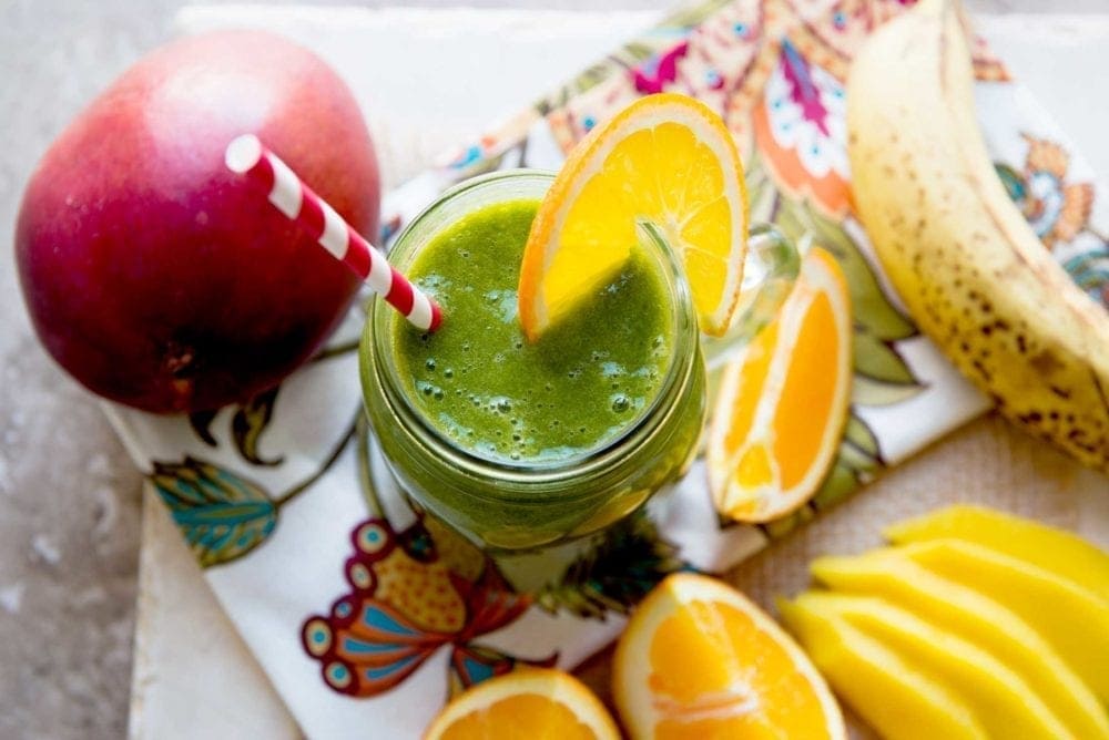 Ingredients for a green mango orange smoothie