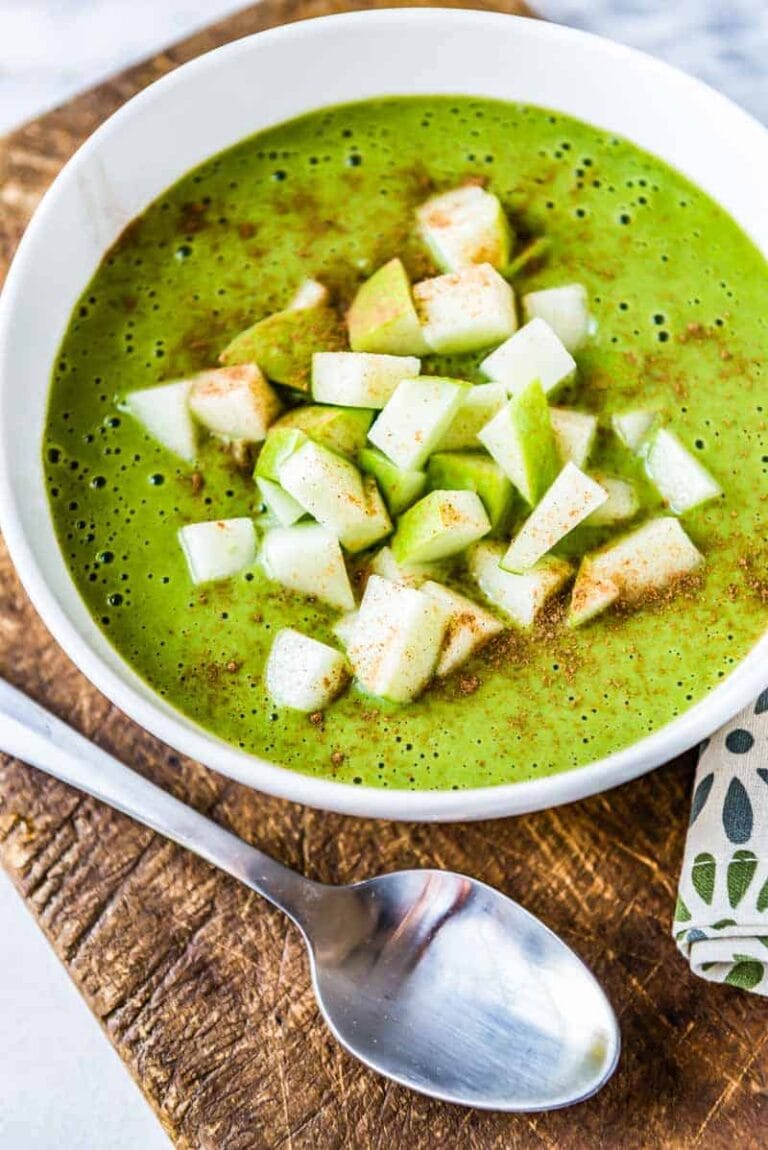 Healthy green smoothie bowl with toppings