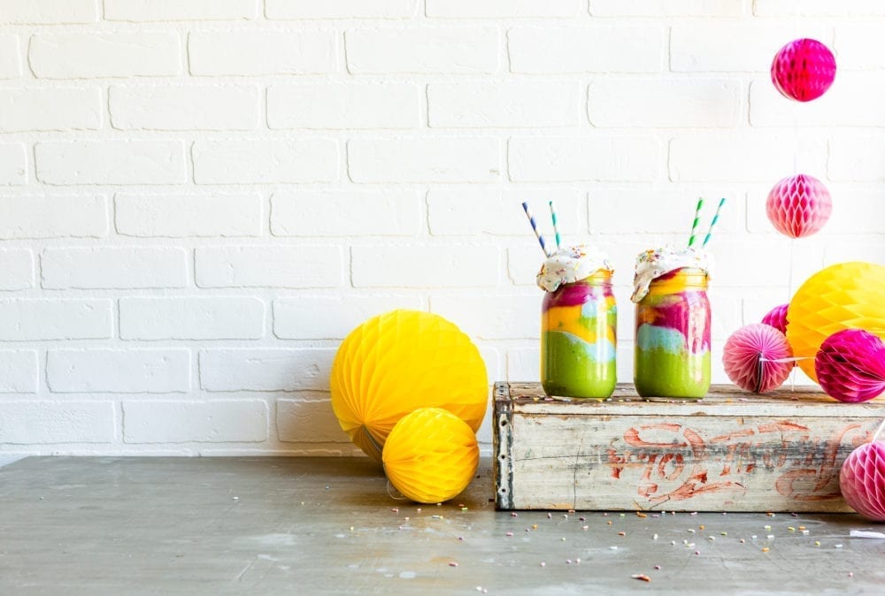 Cute paper straws in a healthy smoothie recipe that's tie dye style.