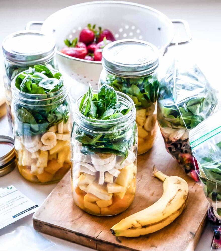 Storing green smoothies in mason jars for freezer prep.