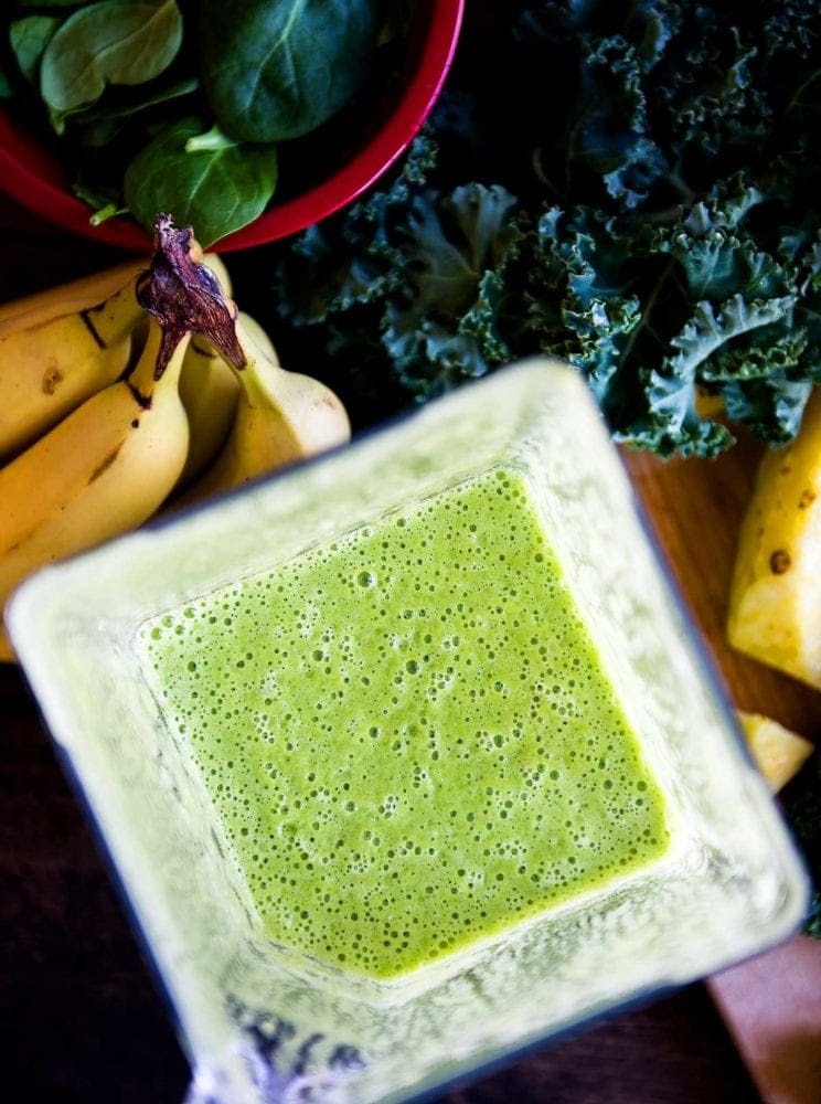 Aerial view of a blended green smoothie with kale.