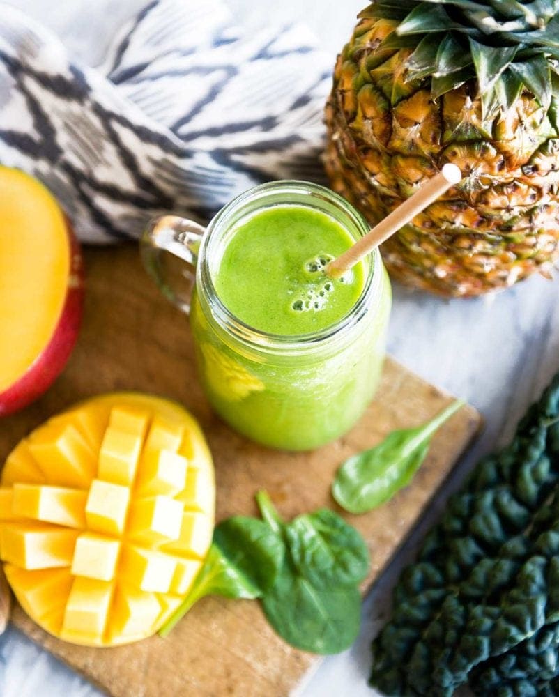 Green Detox Smoothie with paper straw and a mason jar