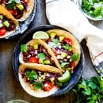 Meatless BBQ Jackfruit Tacos topped with an array of delicious toppings.