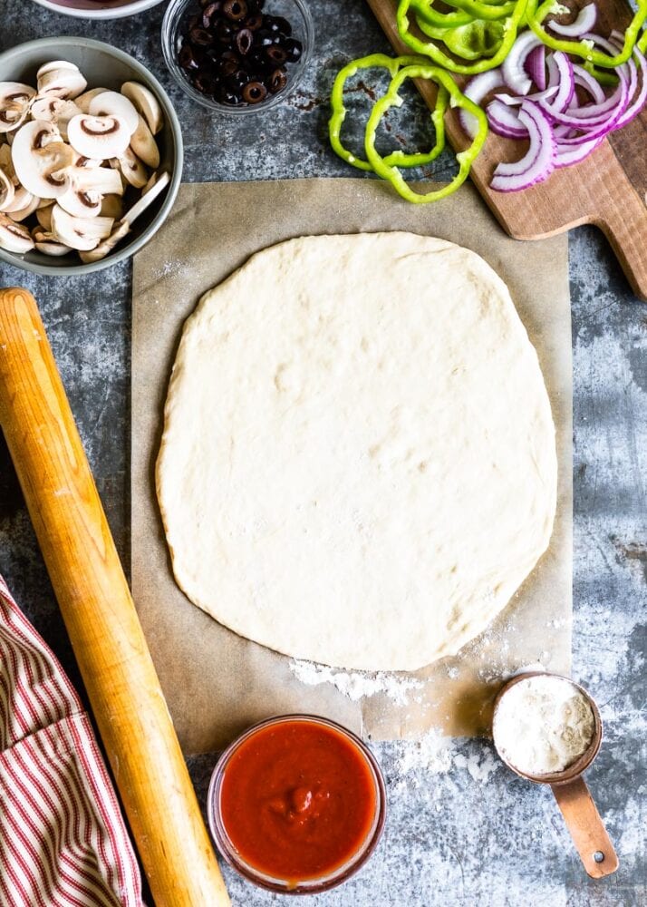 how to roll pizza dough