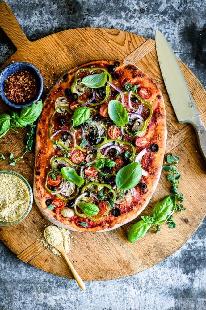 classic vegan pizza recipe with lots of flavor and nutritional yeast