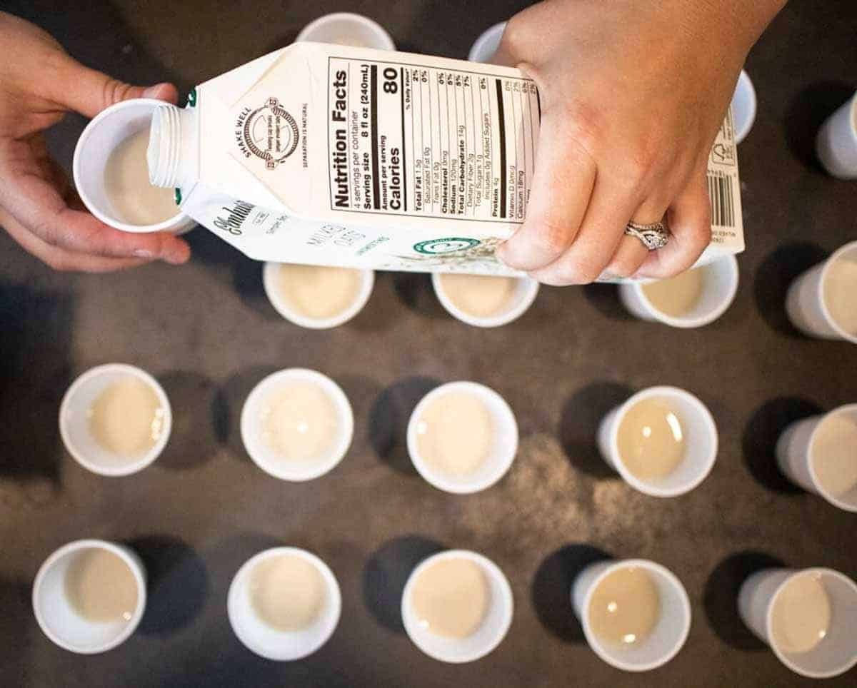 best oat milk brands tested by pouring into plain cups for a blind tastetest