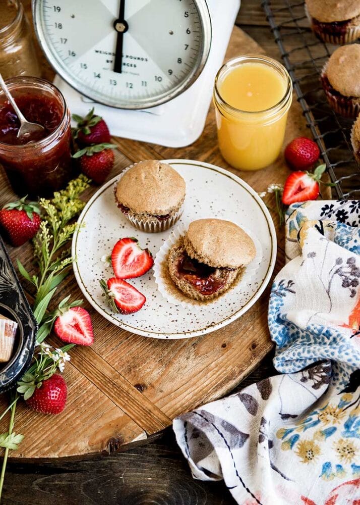 Breakfast table with vegan muffins and fresh strawberry jam.