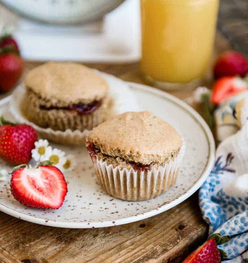 plate with strawberry vegan muffins and fresh fruit