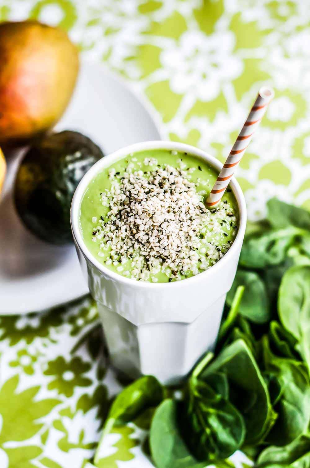 a milkshake glass full of brain fuel smoothie recipe, topped with best brain food ingredient, hemp hearts. 