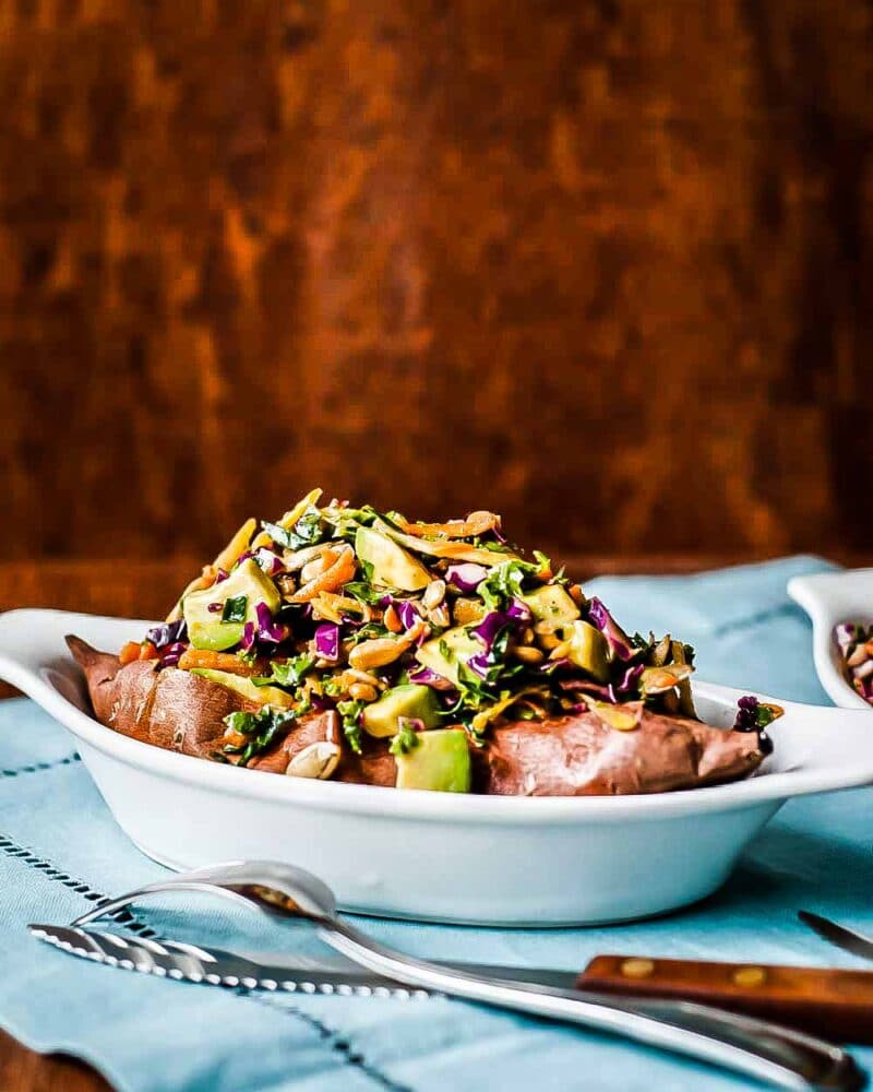 beautiful loaded sweet potato with kale slaw in fun a gratin bowl oven baked to perfection