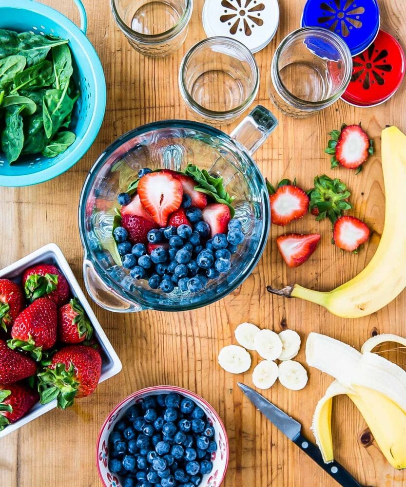 Bananas, blueberries and spinach in blender