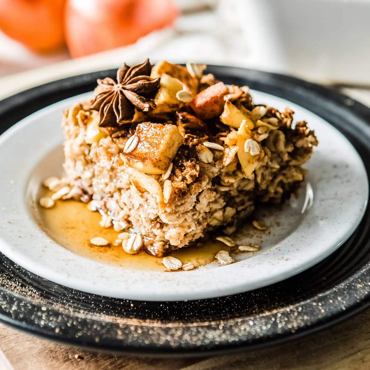 Delicious cinnamon apple baked oatmeal with toppings on a plate.