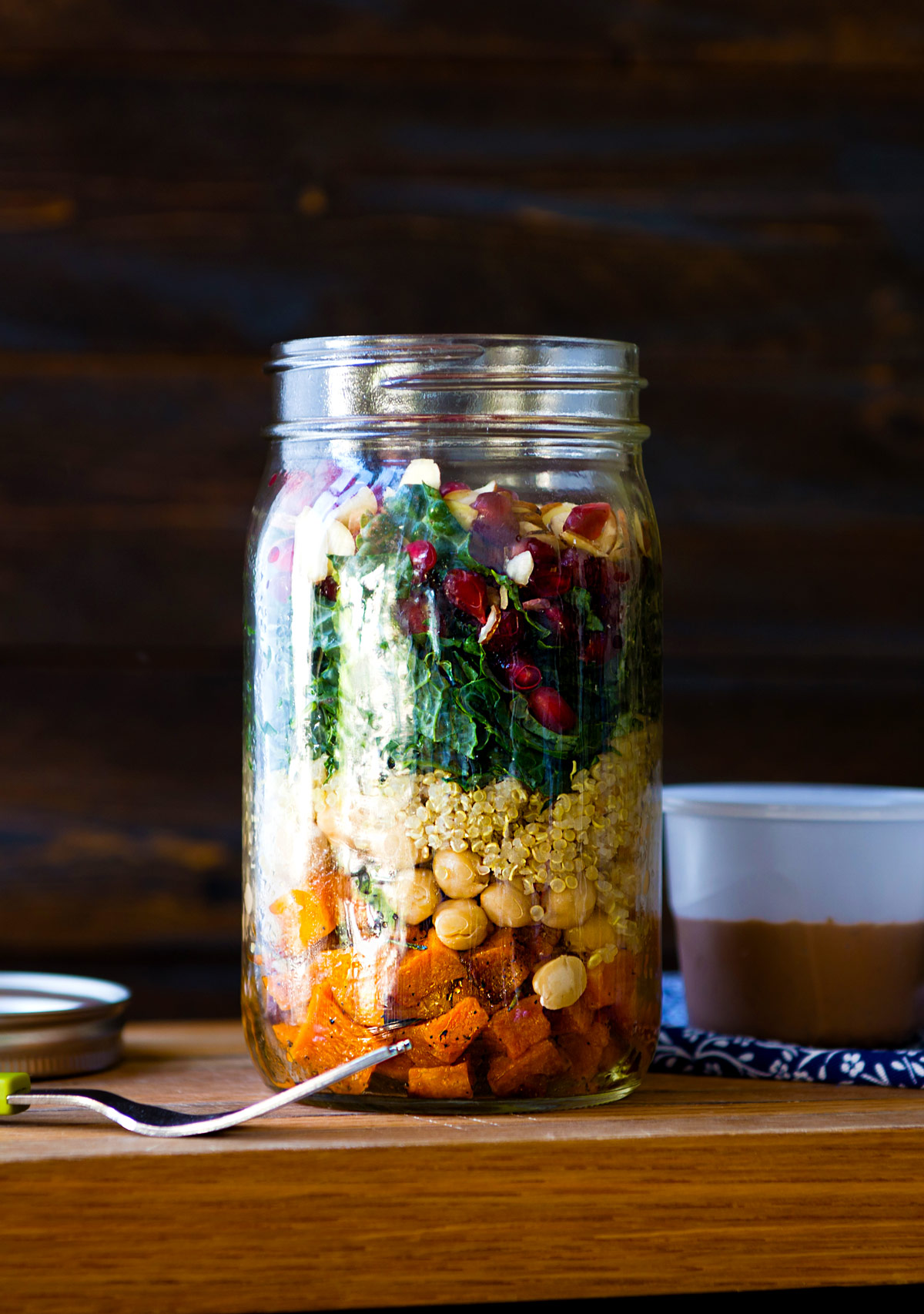 Mason jar salad recipe with sweet potatoes and kale.