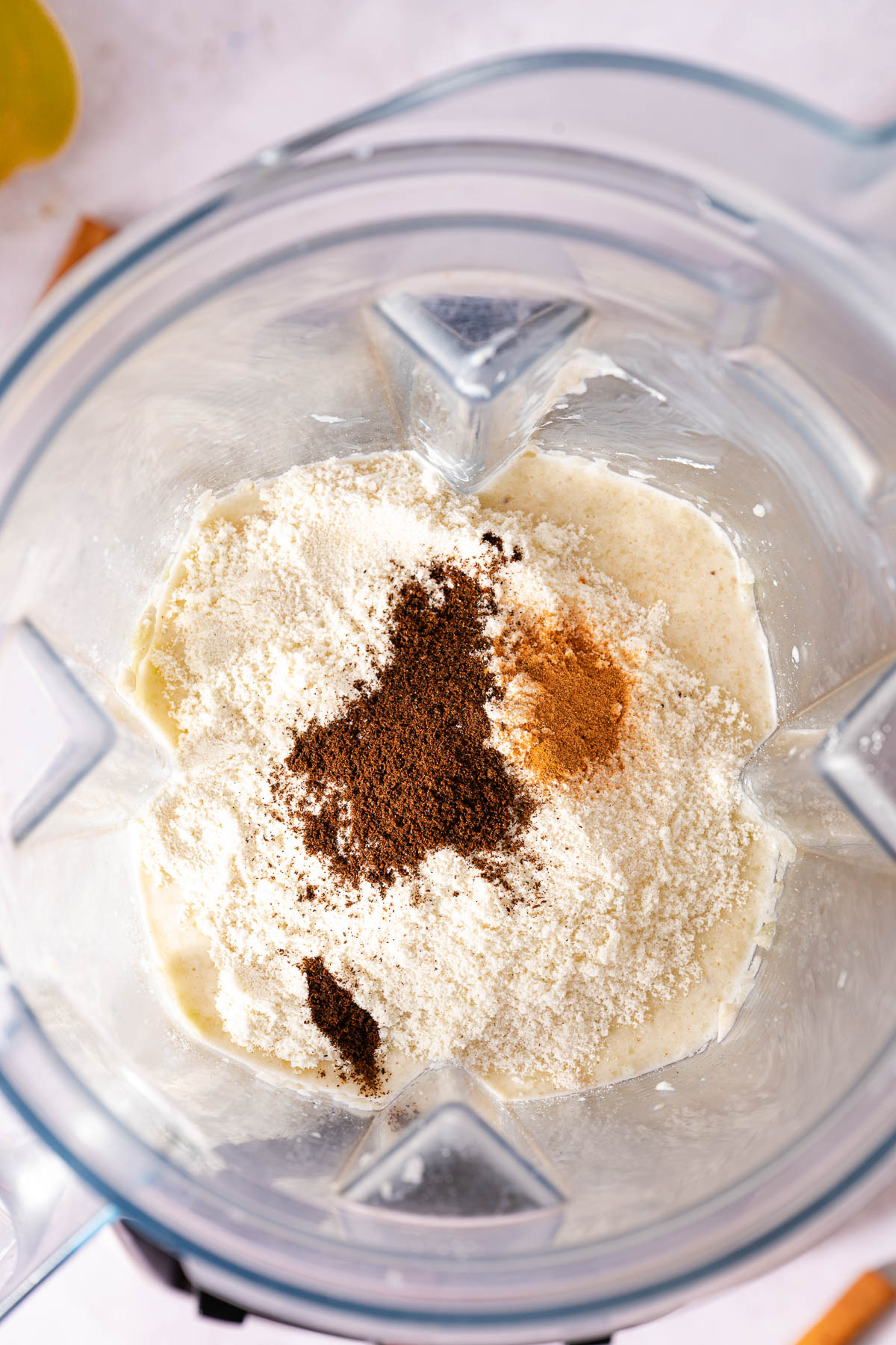Ingredients for banana protein shake in a blender