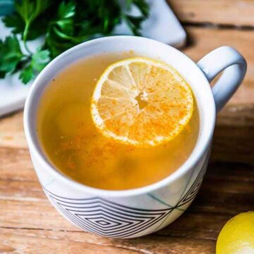 fresh teacup of the best detox tea with sliced lemon