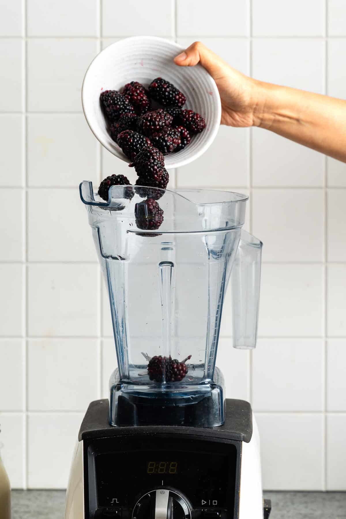 Adding blackberries to a blender