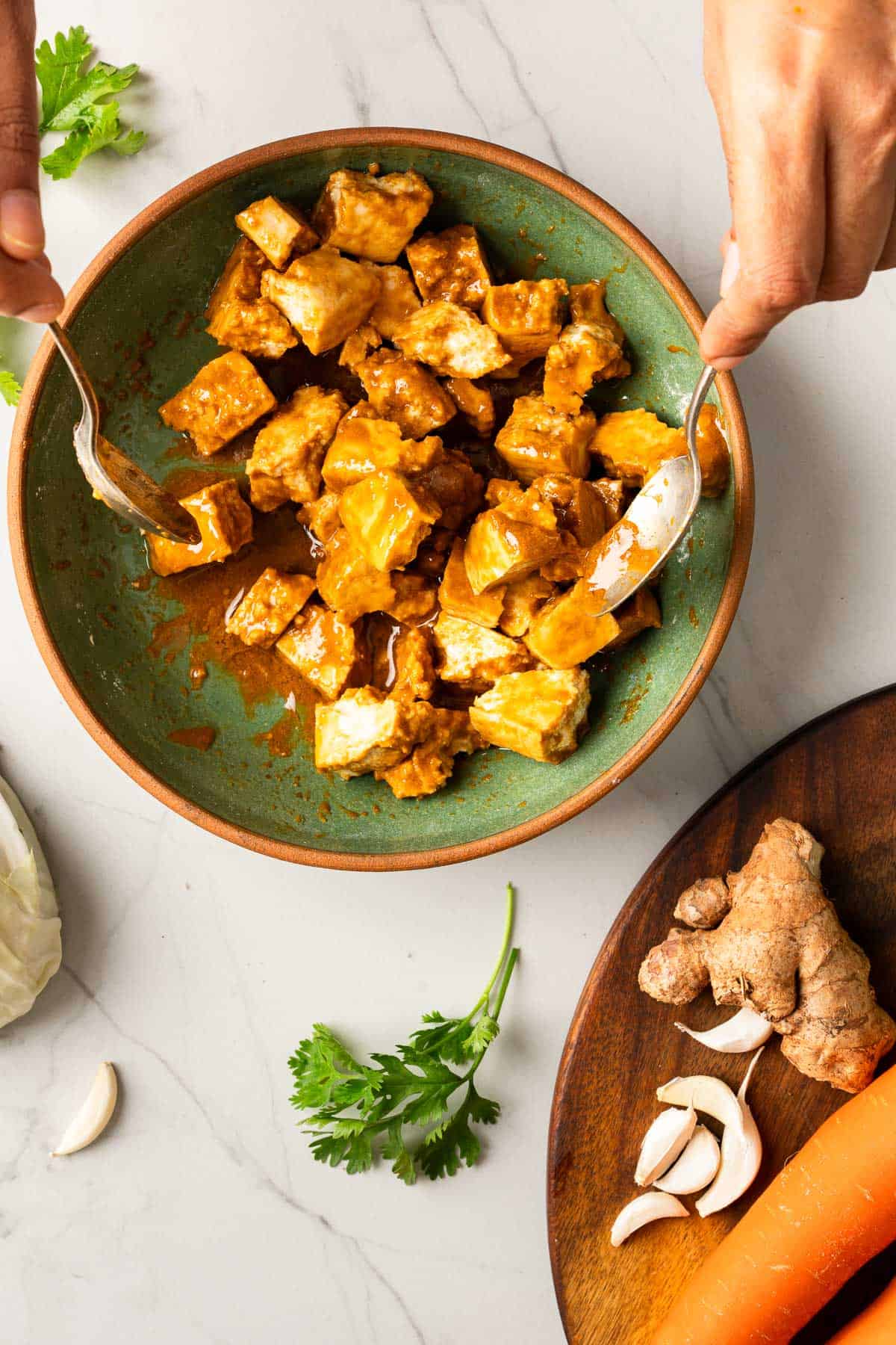 Mixing tofu with batter in a bowl