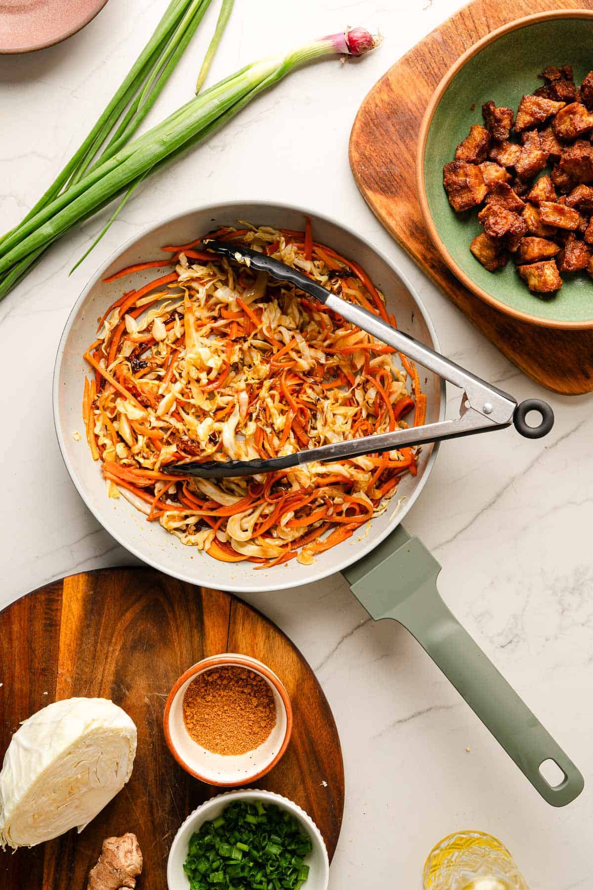 Sautéed cabbage and carrots coated in stir fry sauce