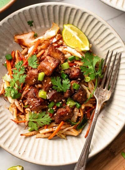 Cabbage stir fry with crispy tofu served on a plate