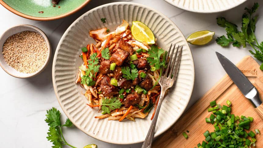 Cabbage stir fry with crispy tofu served on a plate