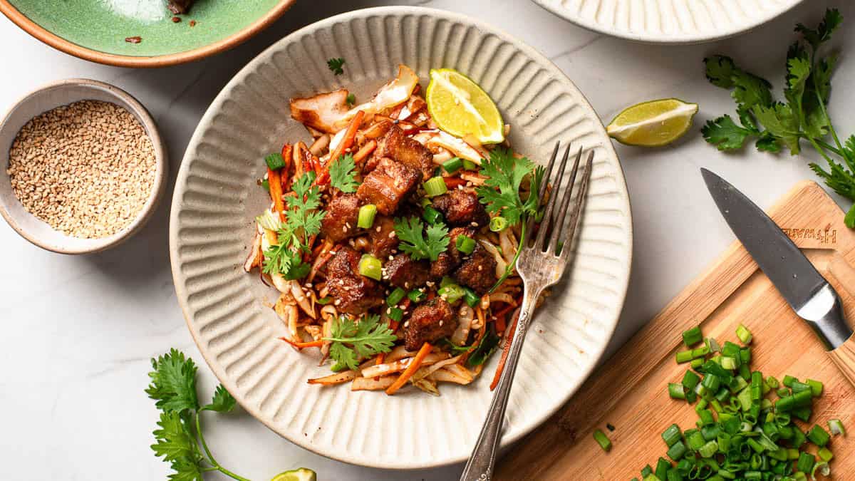 Cabbage stir fry with crispy tofu served on a plate