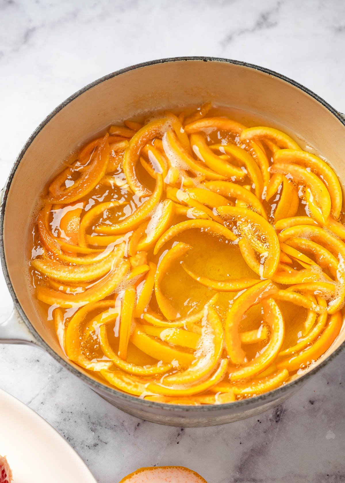 Grapefruit skin strips soaked into the sugar syrup