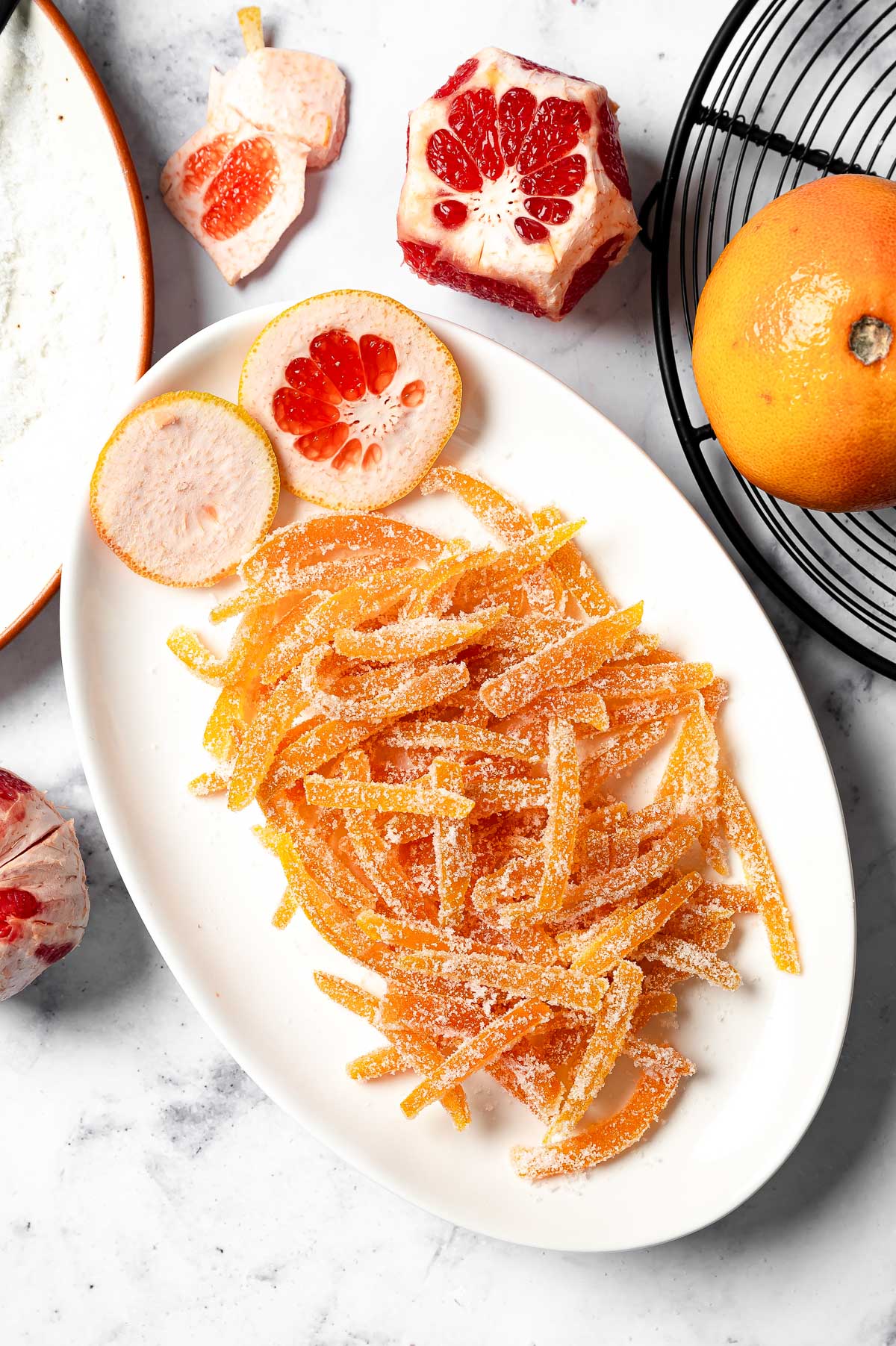 Sugary candied grapefruit peel strips coated in granulated sugar and ready to enjoy