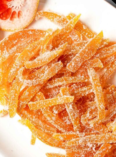 Sugary candied grapefruit peels piled on a serving dish