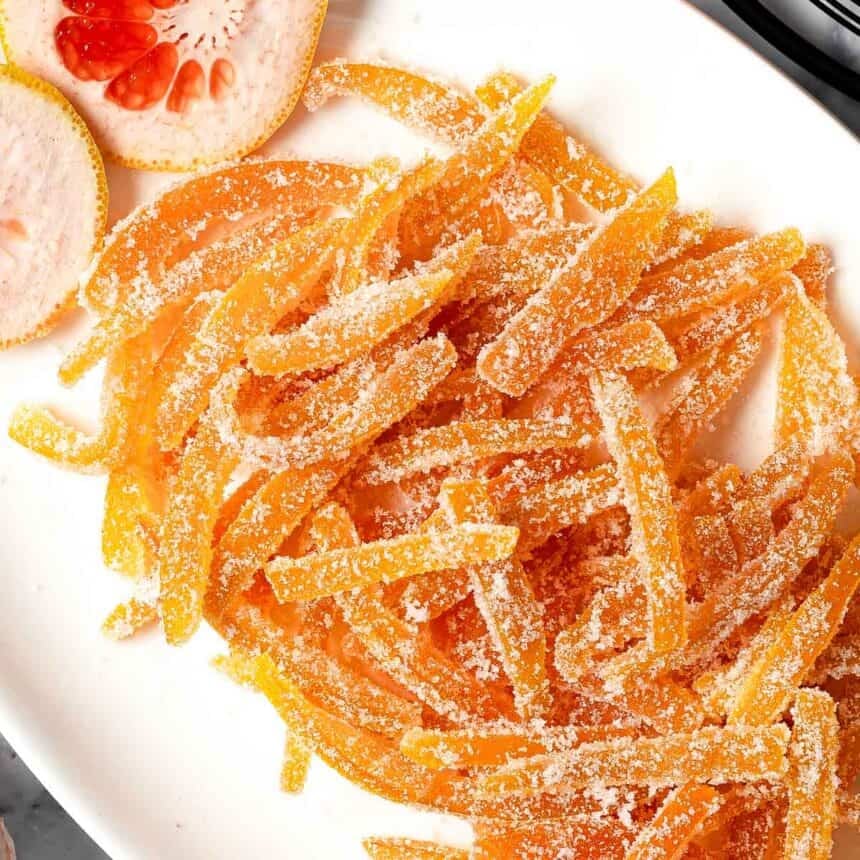 Sugary candied grapefruit peels piled on a serving dish
