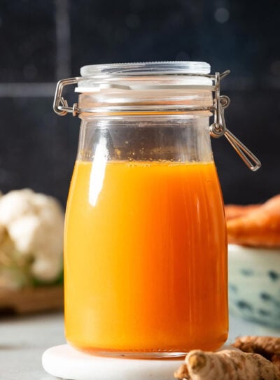 Fresh carrot turmeric juice in a glass