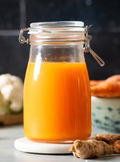 Fresh carrot turmeric juice in a glass