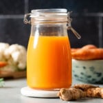 Fresh carrot turmeric juice in a glass