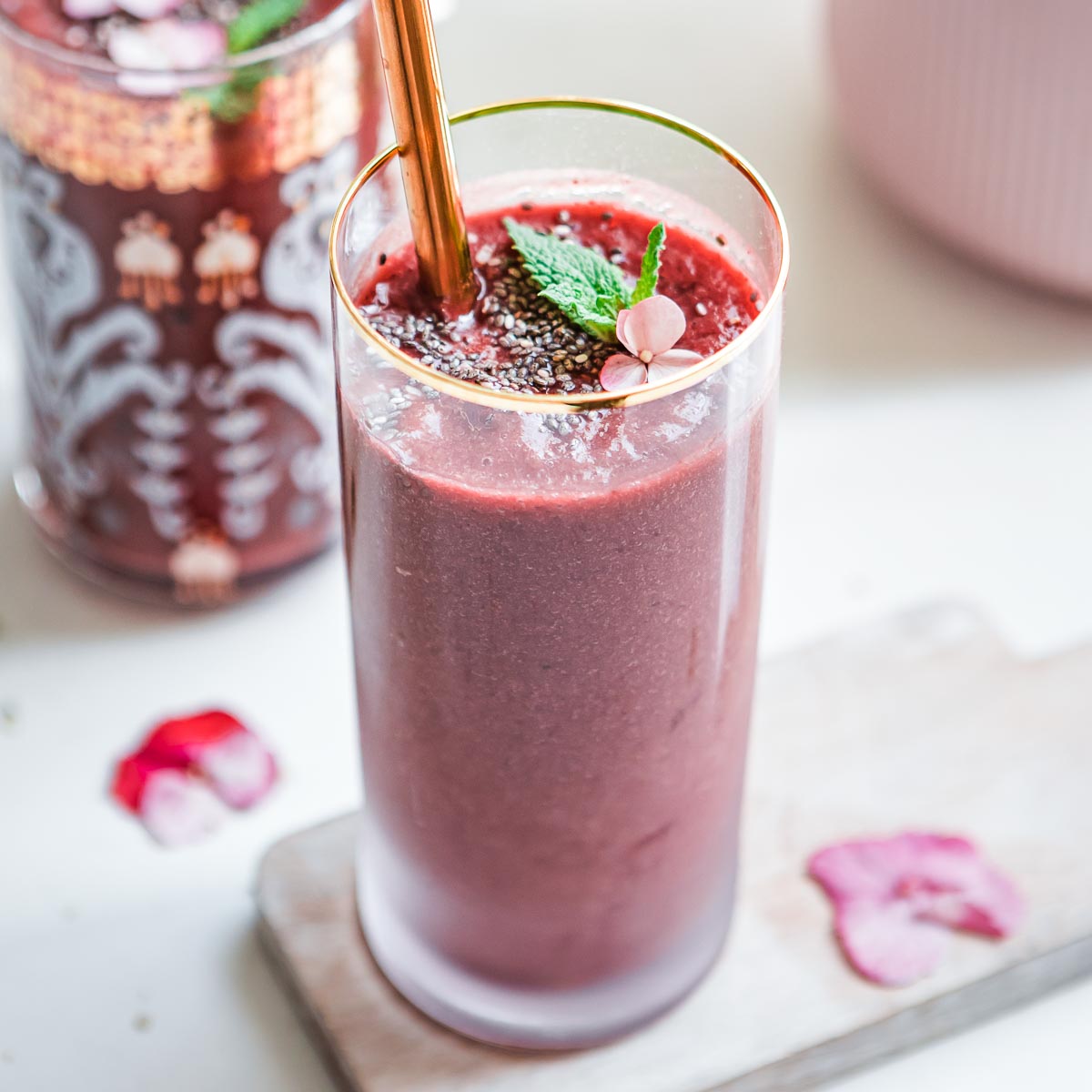Cherry beet smoothie in a tall glass.