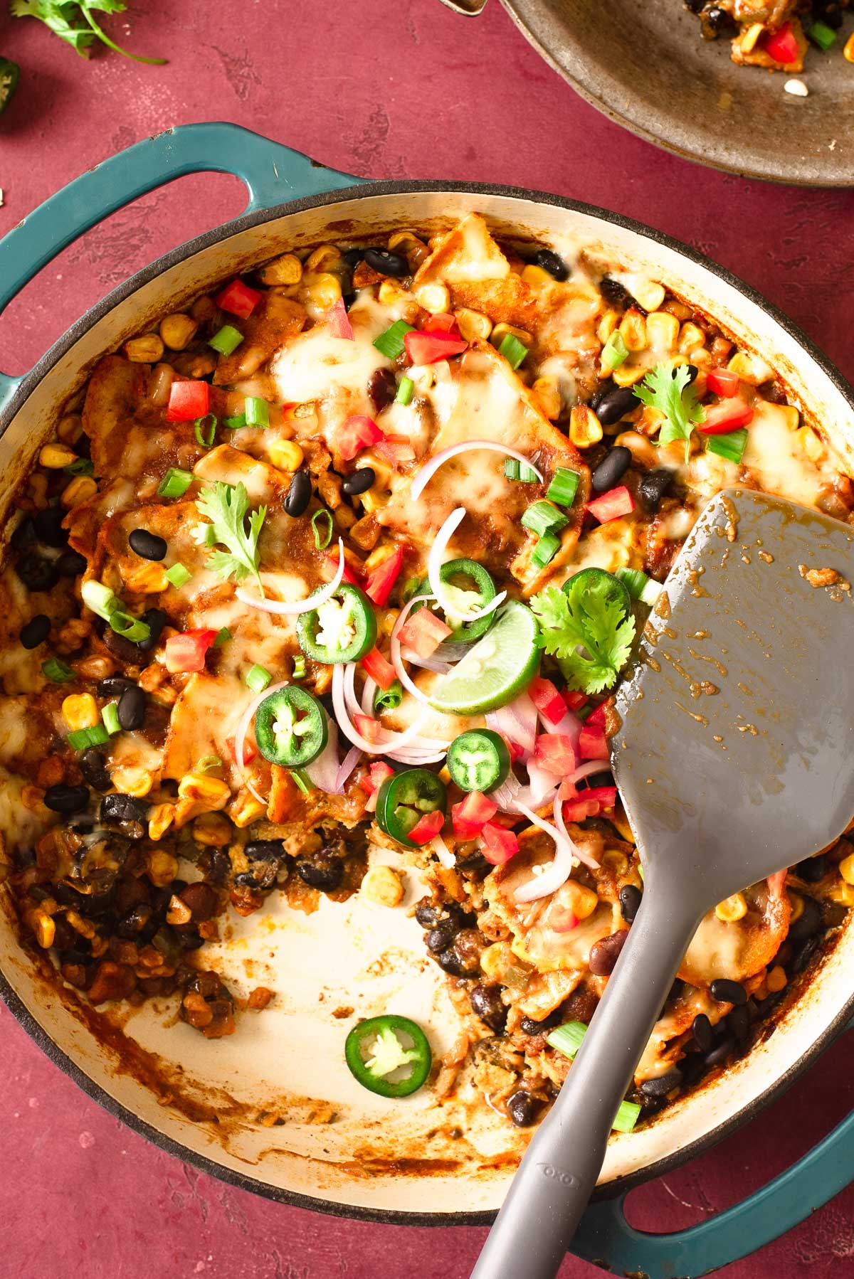 A skillet filled with warm, hearty chopped vegan enchilada