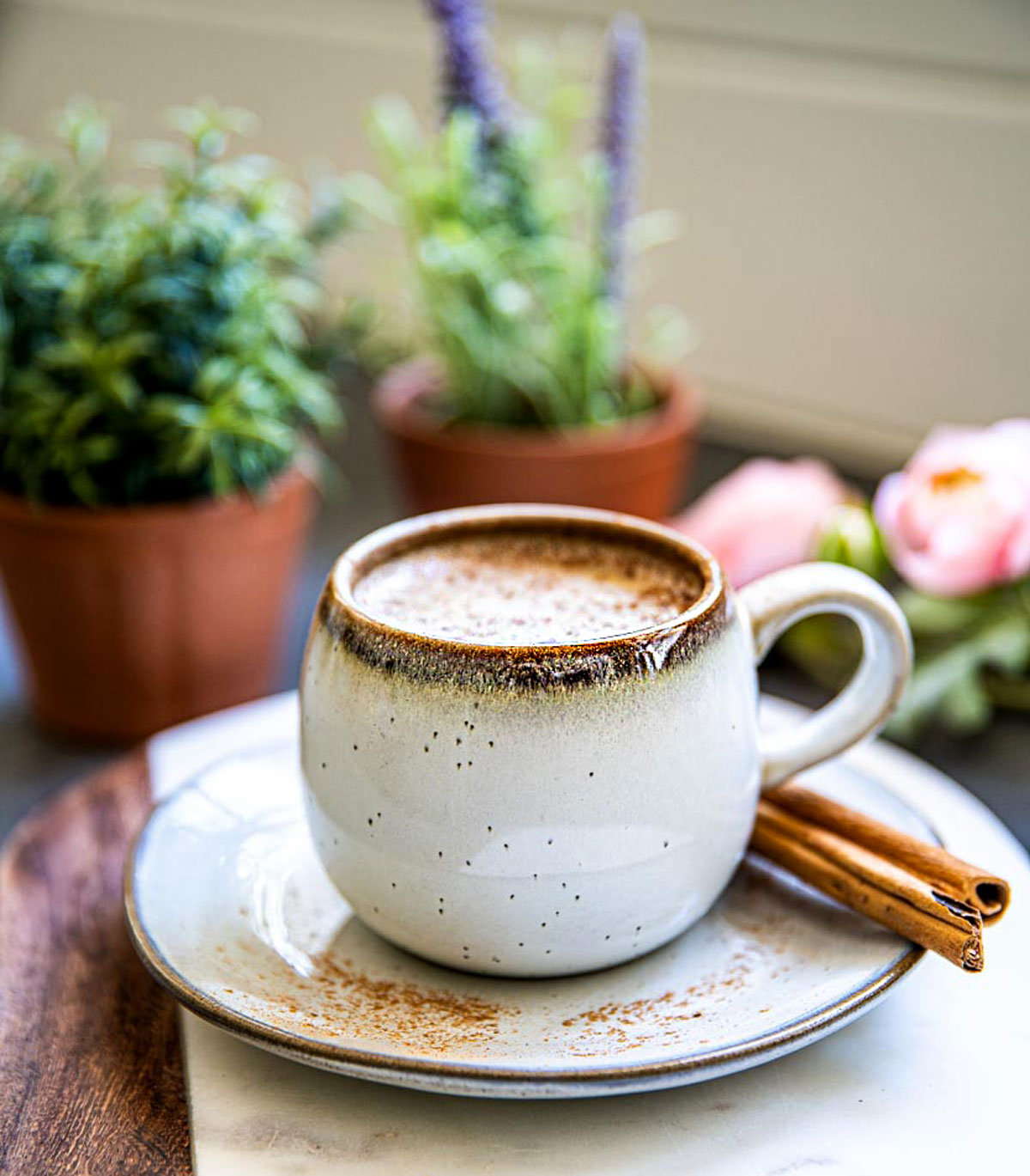 Cinnamon dolce latte topped with foam and sprinkled cinnamon.