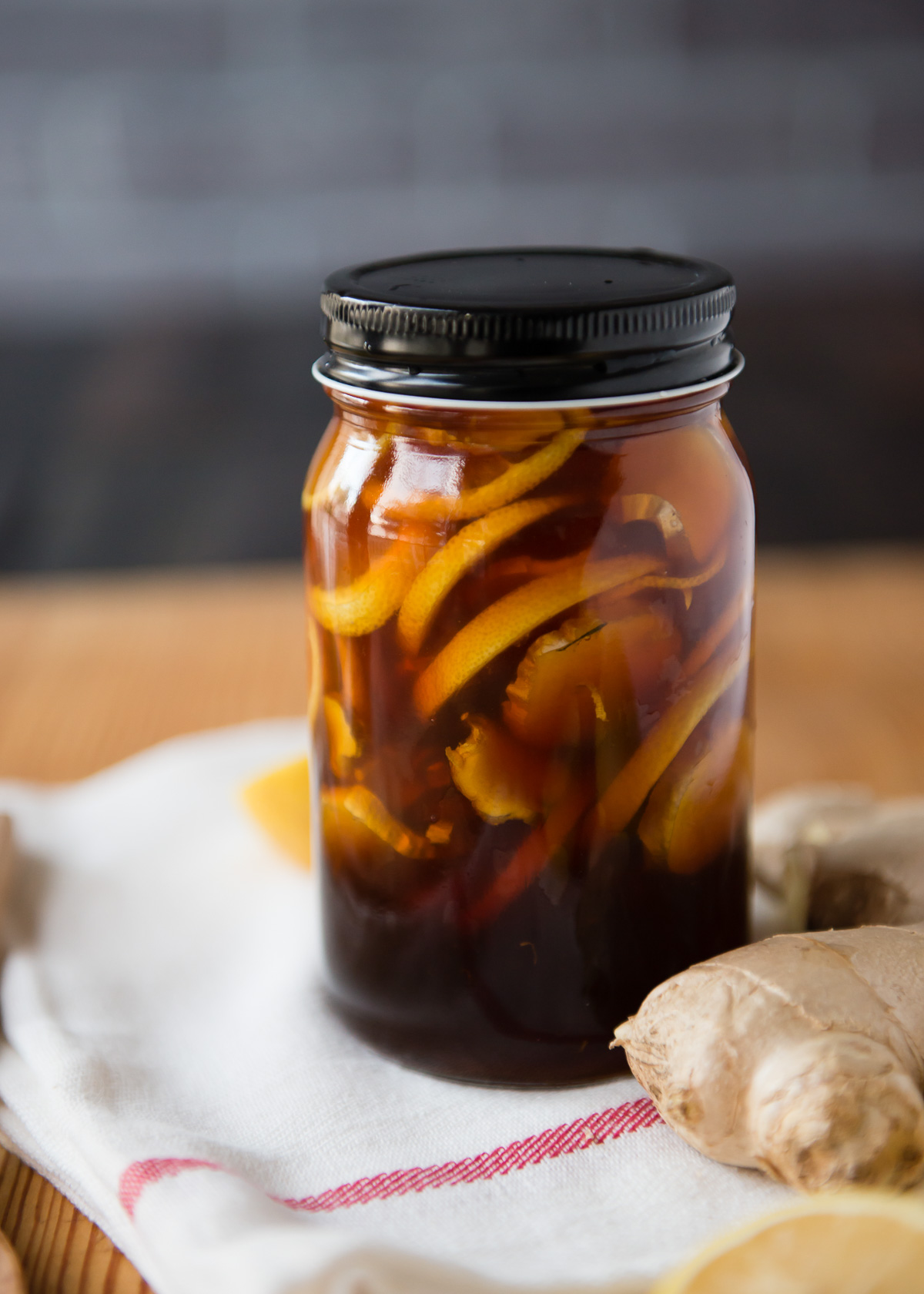 Large mason jar of Ginger Lemon Honey Tea.