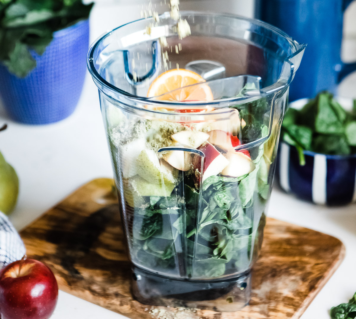 Glowing green smoothie ingredients in a blender 