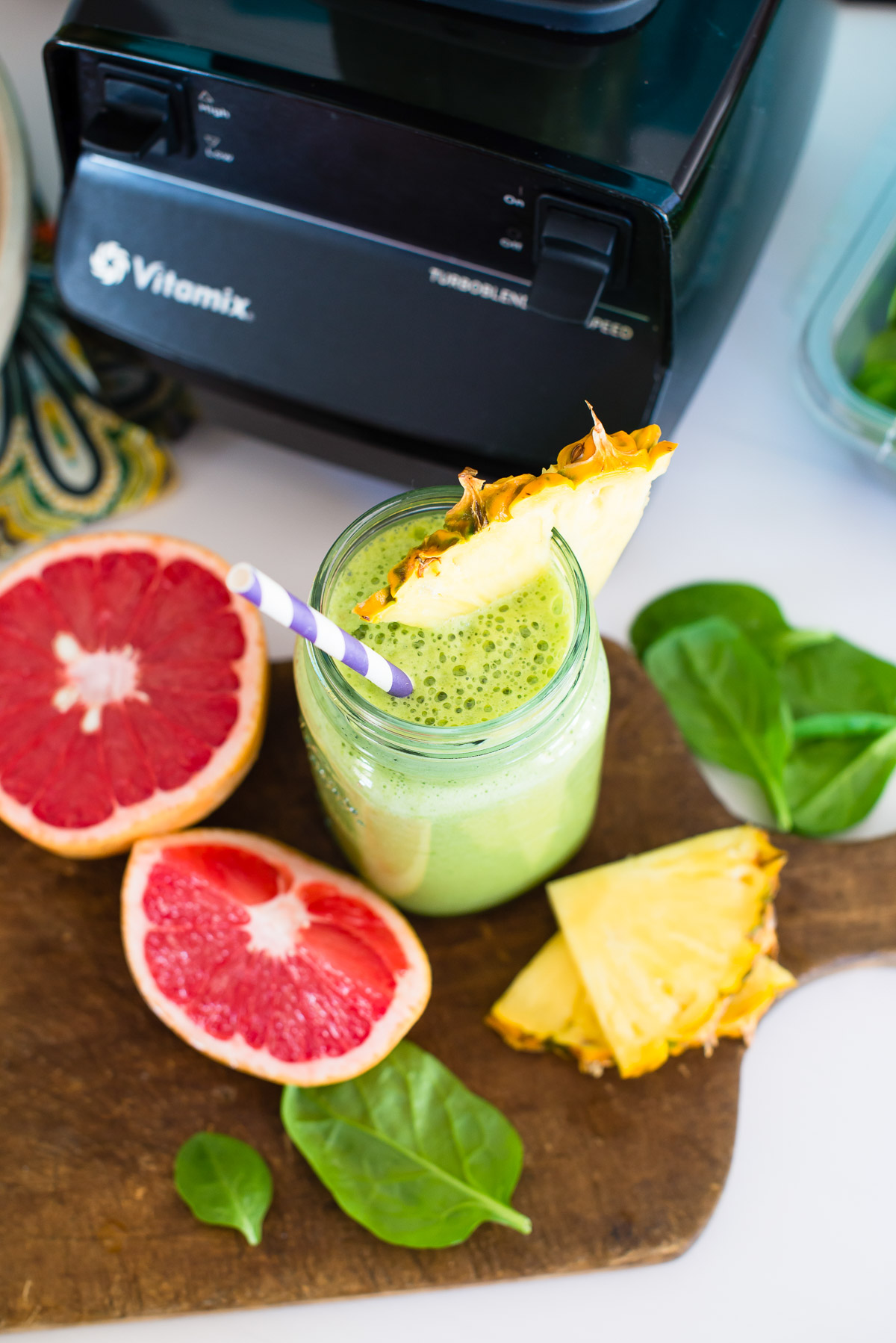 Energy smoothie in a mason jar with a pineapple garnish