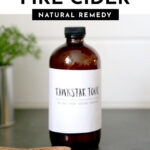 dark glass bottle with white label that says Rawkstar Tonic, a fire cider recipe