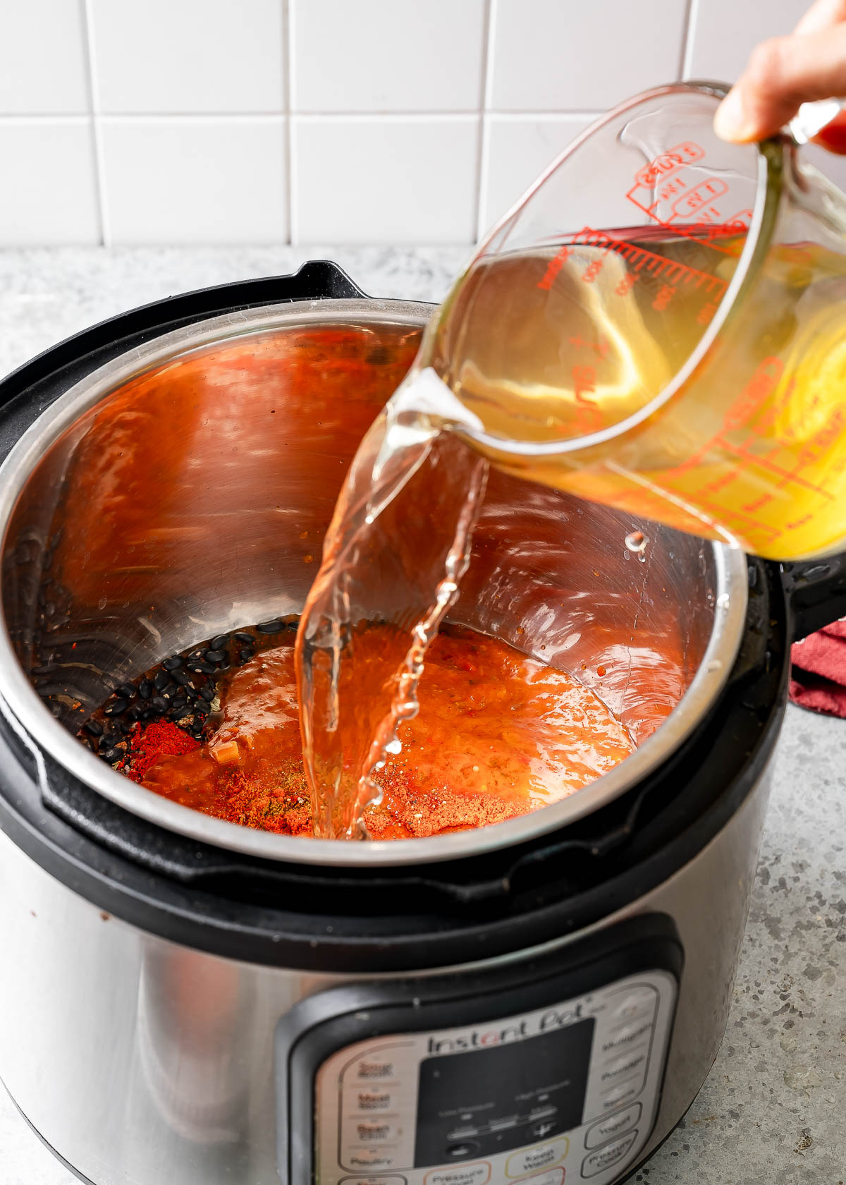 Vegetable stock being poured into an instapot