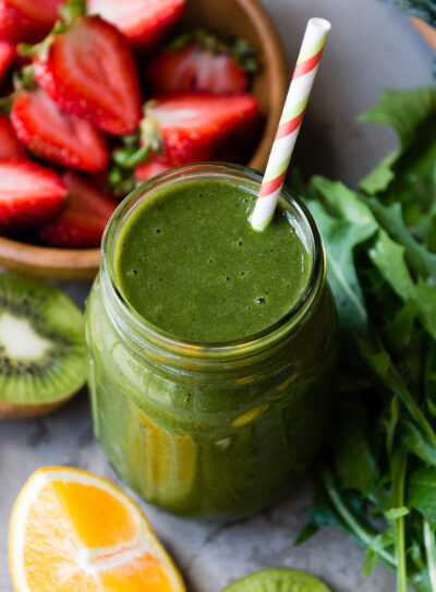Citrus kiwi smoothie with fruits and greens.