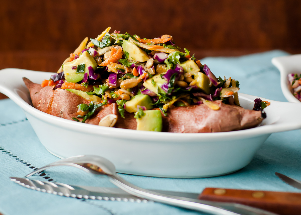 Freshly made loaded sweet potato with kale slaw