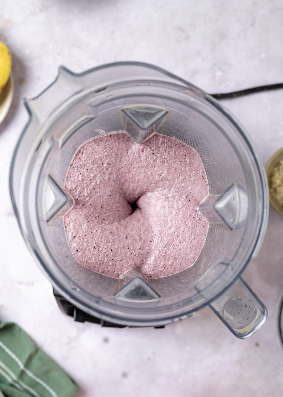 Low-calorie protein shake blending in a blender on low