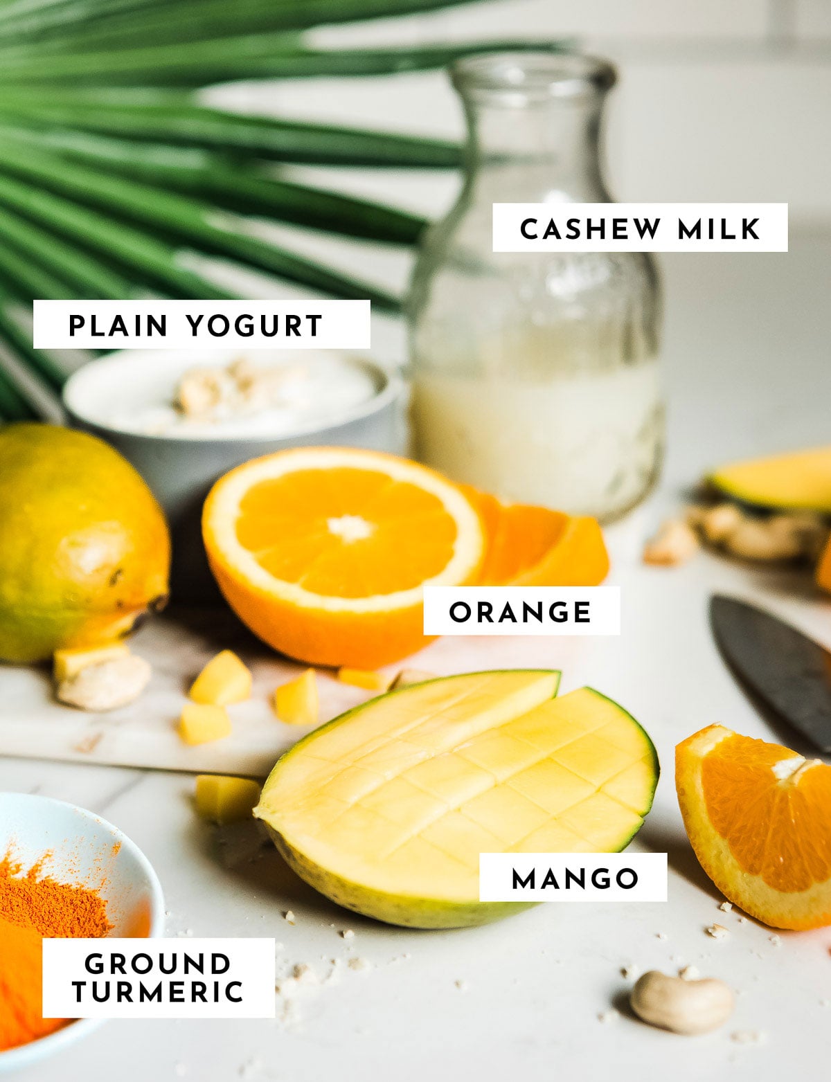 Ingredients for making mango smoothie on table.